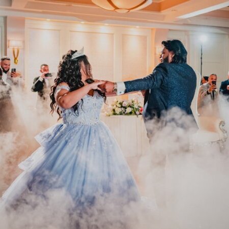 Quinceañera celebrant dancing with her father